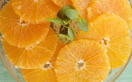 3d обои Нарезанные дольки апельсина  листья