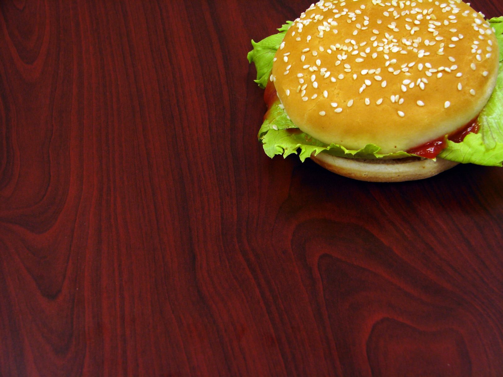 3d обои Гамбургер, из которого выглядывает листик салата  еда # 36321